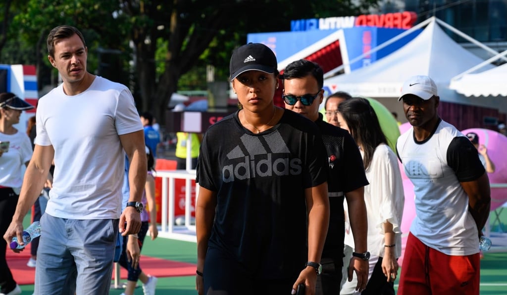 Osaka heads to the autograph booth in the tournament village at Victoria Park. Photo: AFP