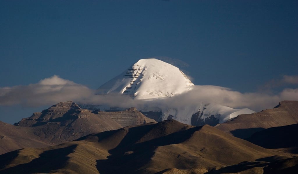 The south face of Mount Kailash rising about the clouds. Photo: Alamy