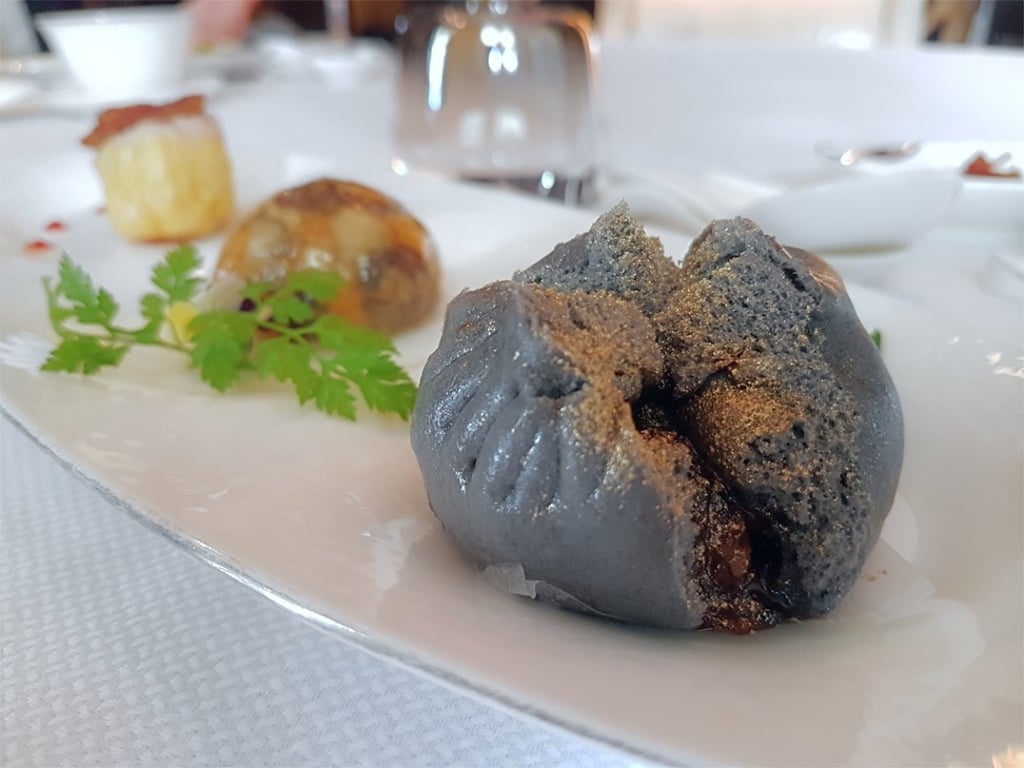 Steamed pork bun with a generous sprinkling of gold dust is on the menu at Cassia, Capella Singapore.