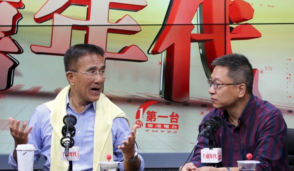 Lawmaker Michael Tien Puk-sun (left) and China Technology Corp's managing director Jason Poon Chuk-hung discussing the railway construction scandals. Photo: Edmond So