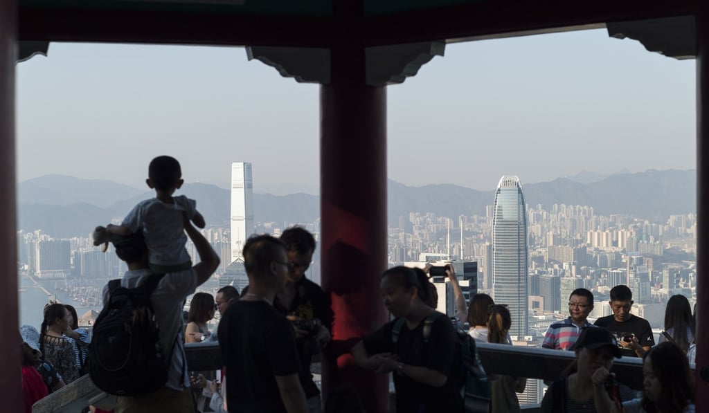 Mainland Chinese tourists visit Victoria Peak in Hong Kong, a favoured destination during the week-long National Day holiday. Photo: EPA Mainland Chinese tourists visit Victoria Peak in Hong Kong, a favoured destination during the week-long National Day holiday. Photo: EPA