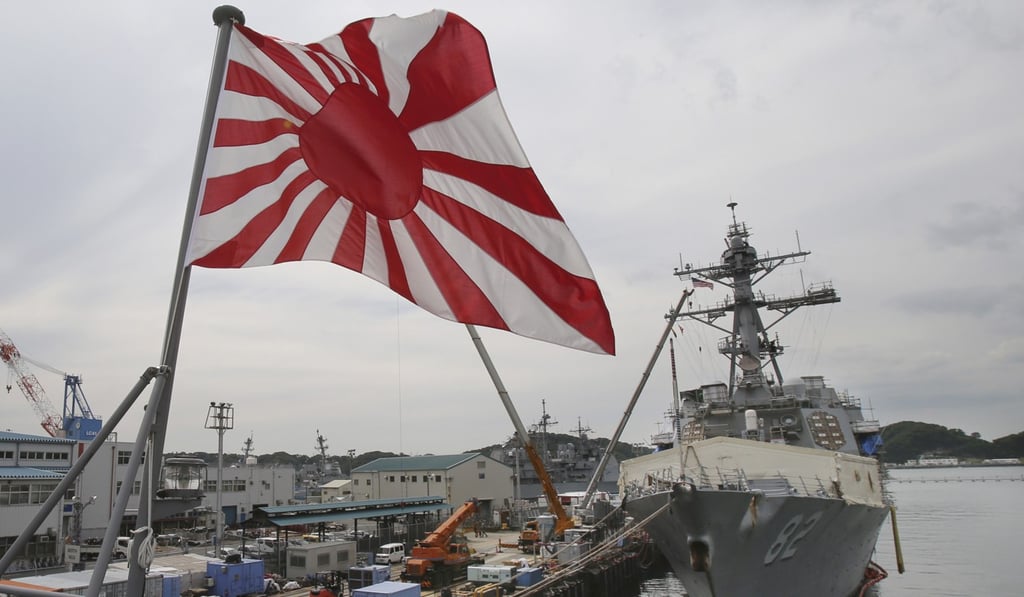 Japan’s ‘Rising Sun’ naval flag is seen as a symbol of military aggression in much of east Asia. Photo: AP