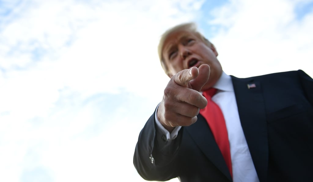 US President Donald Trump (seen on Wednesday) blamed the Fed for the loss in stocks after it raised interest rates. Photo: AFP