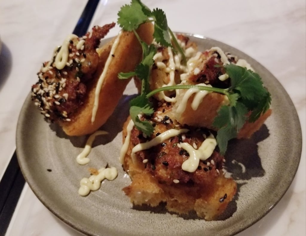 Prawn and chorizo on toast at Maze Grill