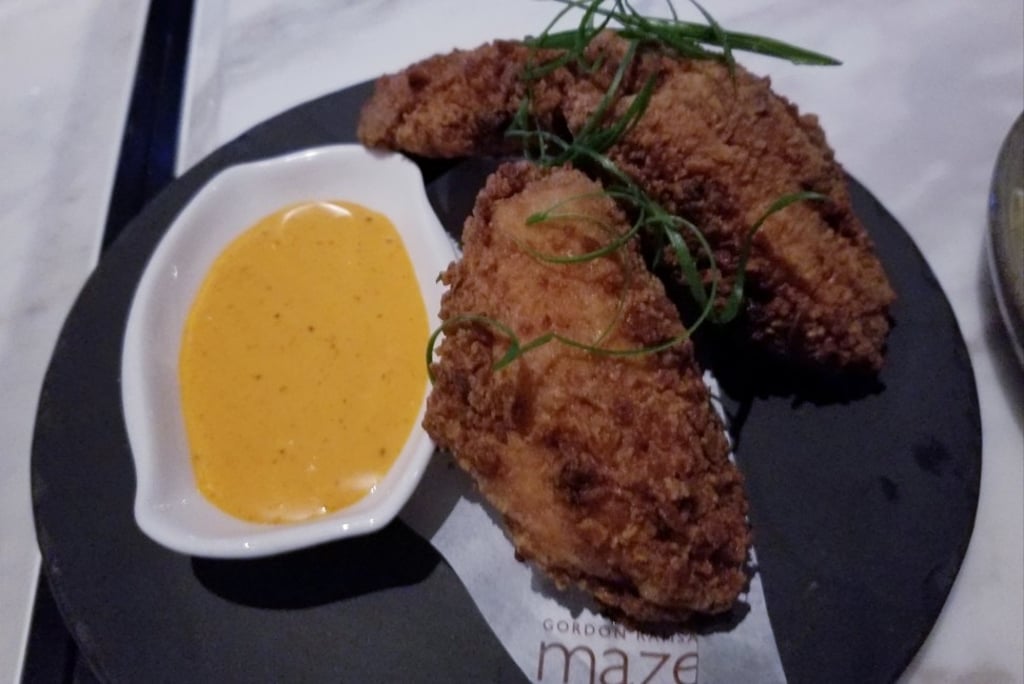 Smoked chicken wings on the starter menu at Maze Grill