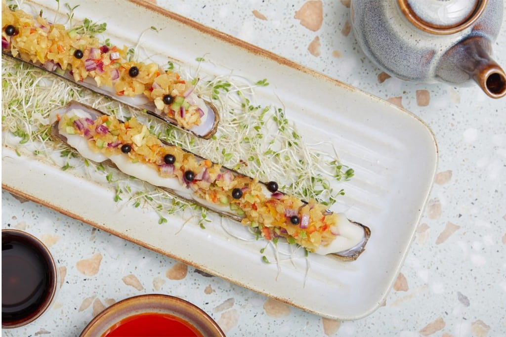 Szechuan pan-seared Australian scallops with cucumber salad is one of the dishes served at the newly opened John Anthony dim sum and Chinese restaurant in Causeway Bay. Szechuan pan-seared Australian scallops with cucumber salad is one of the dishes served at the newly opened John Anthony dim sum and Chinese restaurant in Causeway Bay.
