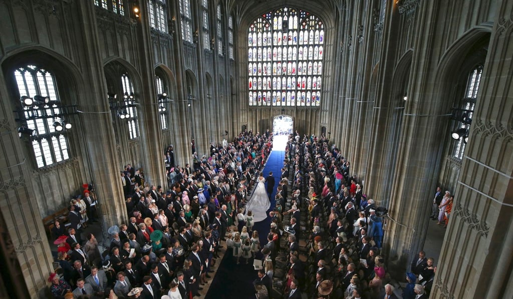 Britain's Princess Eugenie of York and Jack Brooksbank walk back down the aisle of the Quire hand in hand at the end of their wedding ceremony. Photo: AFP Britain's Princess Eugenie of York and Jack Brooksbank walk back down the aisle of the Quire hand in hand at the end of their wedding ceremony. Photo: AFP