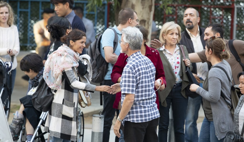 Members of Brunson’s Izmir Dirilis (Resurrection) Church celebrate as they wait for him outside his house after he was released on Friday. Photo: EPA