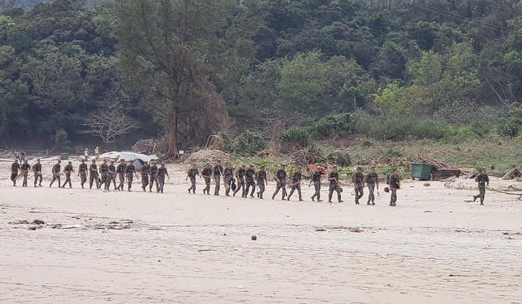 PLA soldiers were called in to remove fallen trees and debris. Photo: Handout