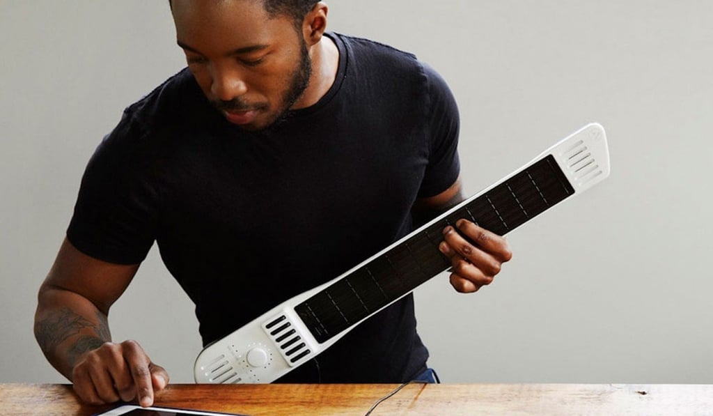 The Artiphon INSTRUMENT 1, which enables you to strum, slide, tap and drum any sound on a single interface. The Artiphon INSTRUMENT 1, which enables you to strum, slide, tap and drum any sound on a single interface.