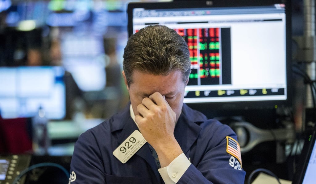 A trader reacts at the New York Stock Exchange on October 11, as the S&P 500, Nasdaq and Dow Jones fall. Photo: Xinhua