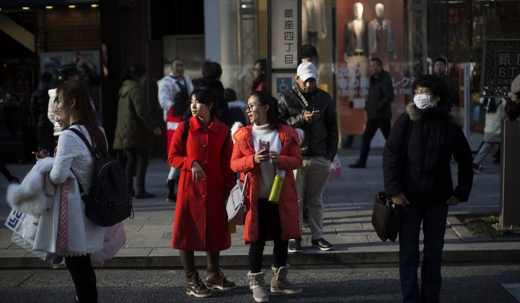 Tourists in the Ginza district of Tokyo, Japan. Photo: Bloomberg