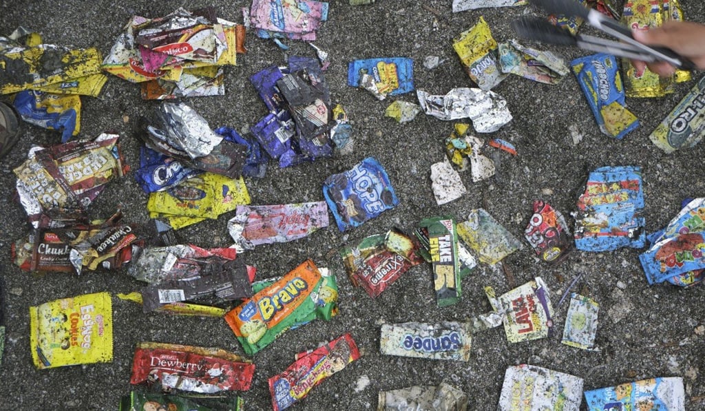 Plastic wrappers washed up on a beach in the Philippines. Photo: Break Free From Plastic