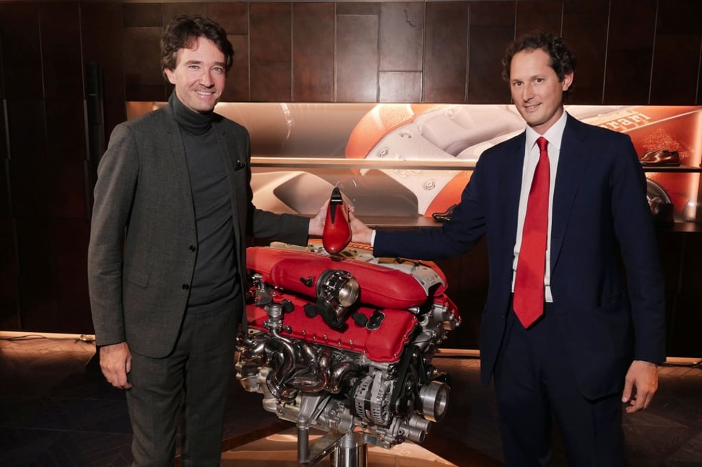 Antoine Arnault, CEO of Berluti, and John Elkann, chairman of Ferrari, show off one of the new designs.