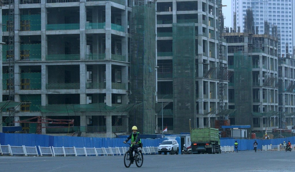 A worker rides a bicycle in the Meikarta development in Cikarang, Bekasi, east of Jakarta. Photo: Reuters