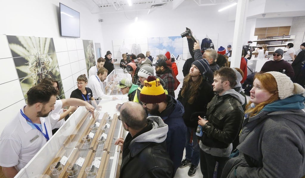 People check out the sample counter at a cannabis store in Winnipeg, Manitoba, on Wednesday. Photo: AP People check out the sample counter at a cannabis store in Winnipeg, Manitoba, on Wednesday. Photo: AP