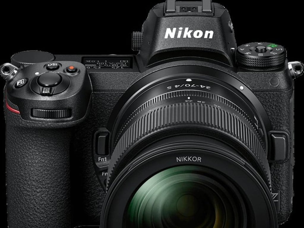 A Nikon mirrorless camera uses telephoto F-Mount Nikkor lenses.