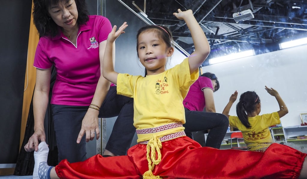Every week professional instructors take time out to teach pupils from kindergarten to Primary Six everything from singing and gestures to stretching and martial arts. Photo: Martin Chan