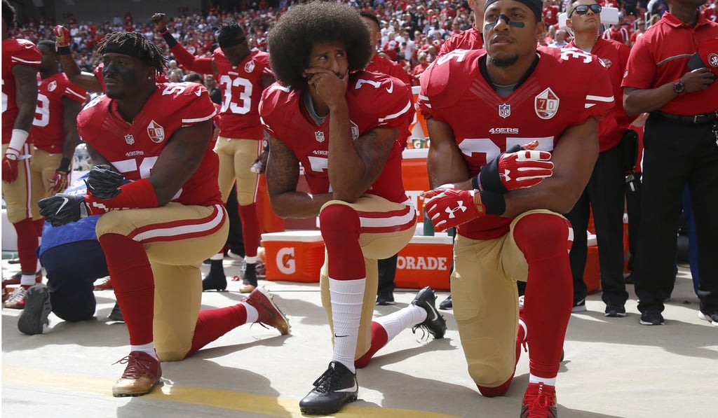 Rihanna reportedly refused the offer in support of Colin Kaepernick (centre). Photo: TNS