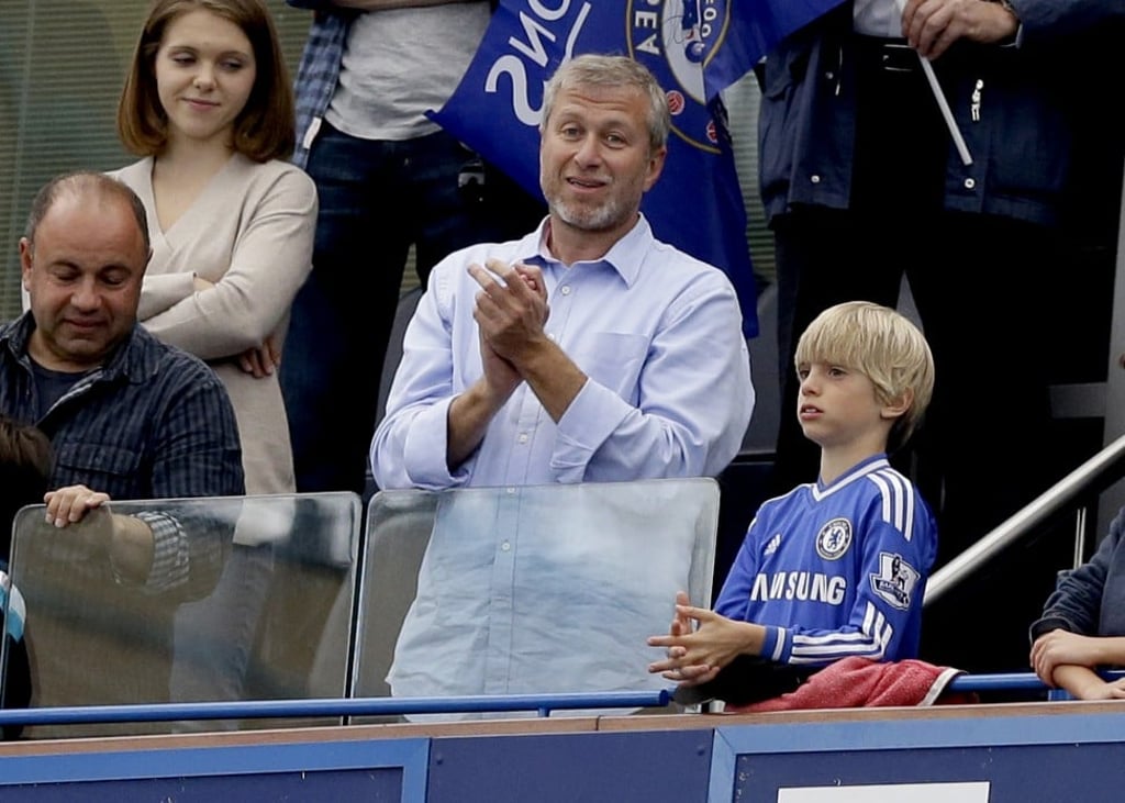Russian billionaire and Chelsea owner Roman Abramovich, centre, applauds as his soccer team, Chelsea Football Club, lifts the English Premier League trophy after defeating Sunderland at Stamford Bridge stadium, London. Photo: AP