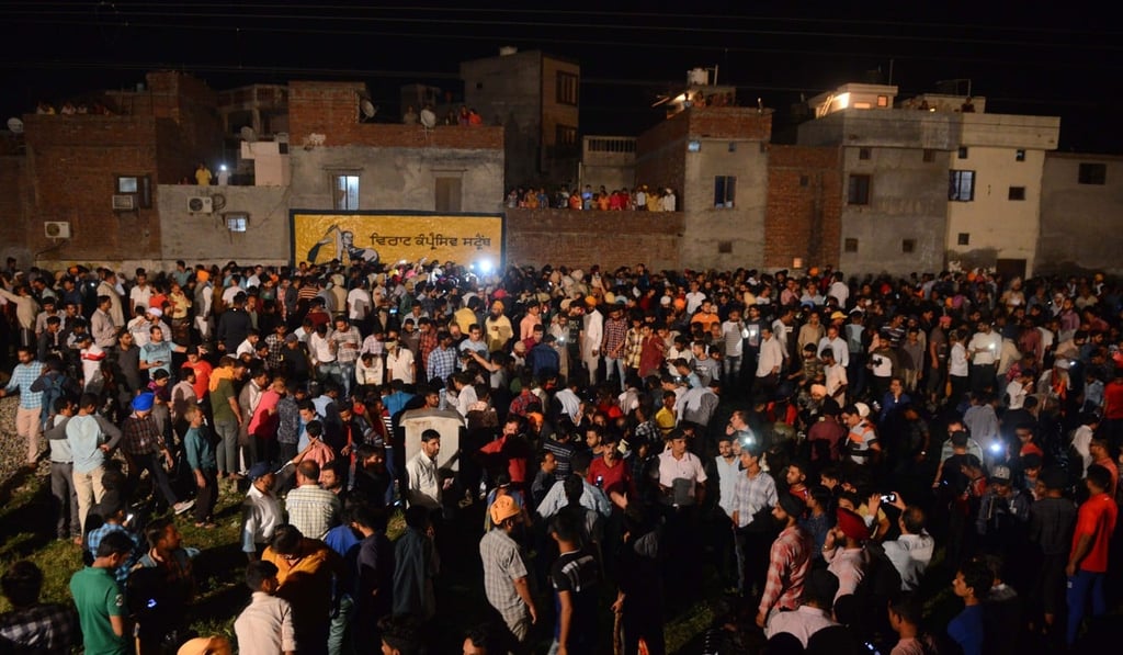 Crowds gather around the bodies of the victims of a train accident during the Hindu festival of Dussehra in Amritsar on Friday. Photo: Agence France-Presse