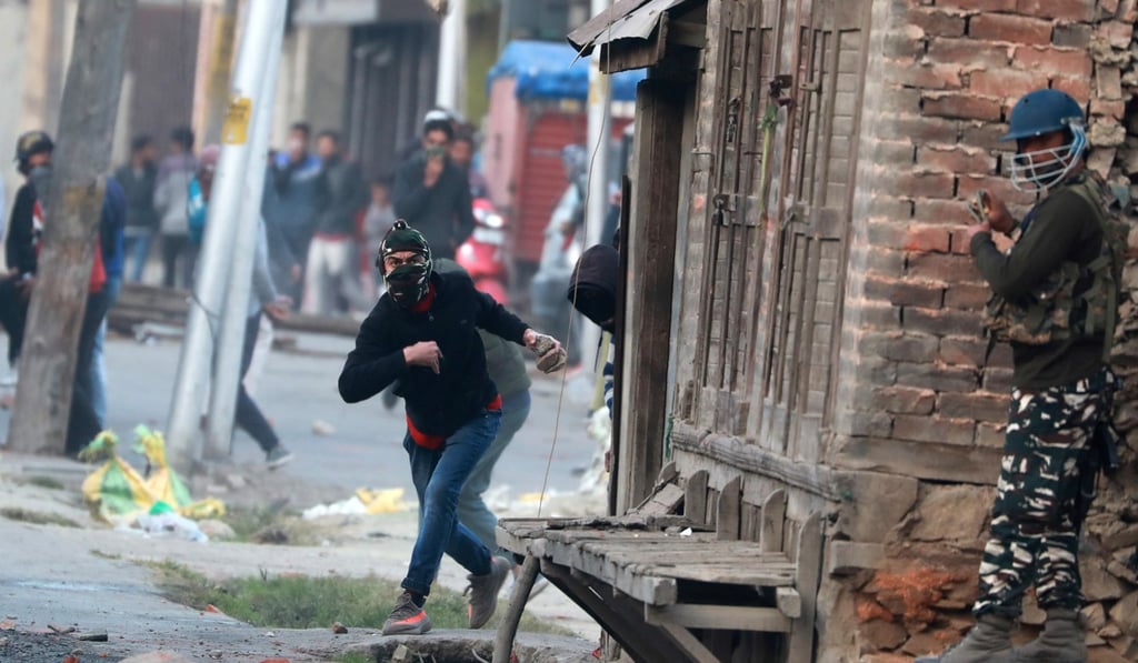 Kashmiri Muslim protesters throw stones at Indian police and paramilitary members during clashes in the downtown area of Srinagar, Kashmir, on Friday. Photo: EPA