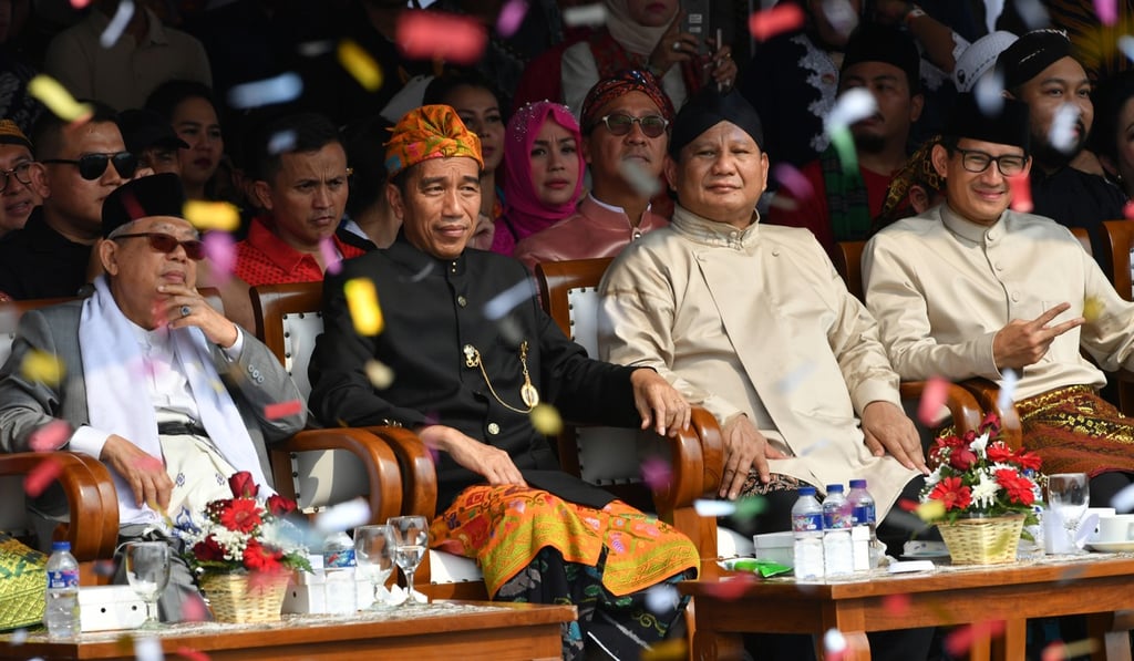 Indonesian President Joko Widodo and his running mate Ma’ruf Amin, left, with presidential candidate Prabowo Subianto and his running mate Sandiaga Uno, right. Photo: AFP