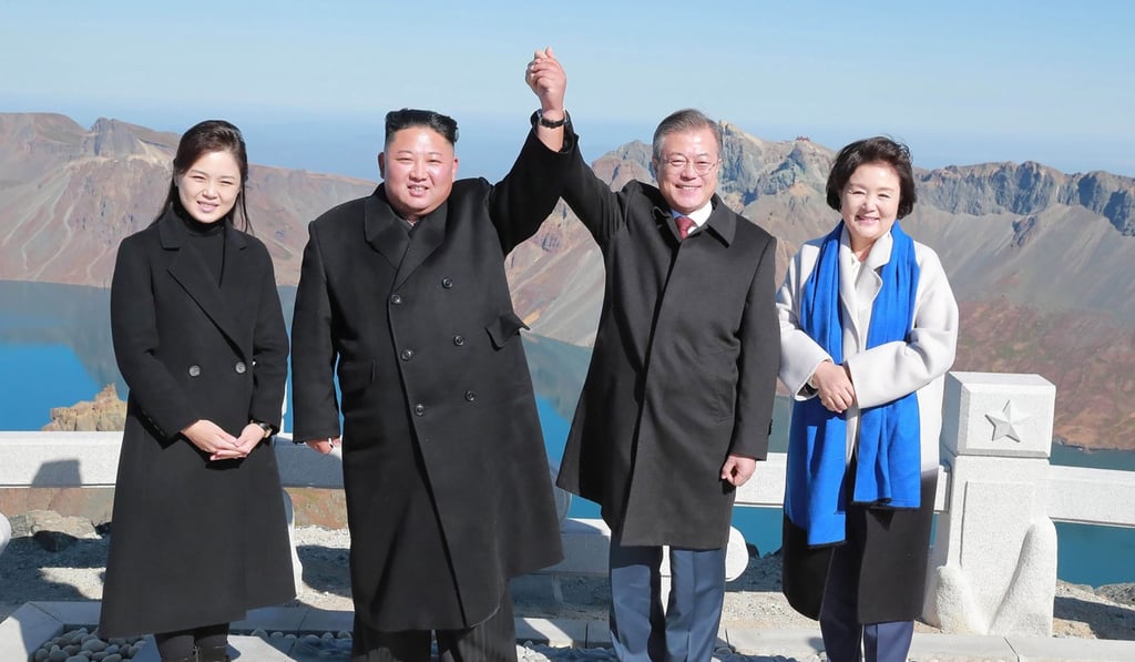 North Korean leader Kim Jong-un and his wife Ri Sol-ju posing with South Korean President Moon Jae-in and his wife Kim Jung-sook on the top of Mount Paektu. Photo: AFP