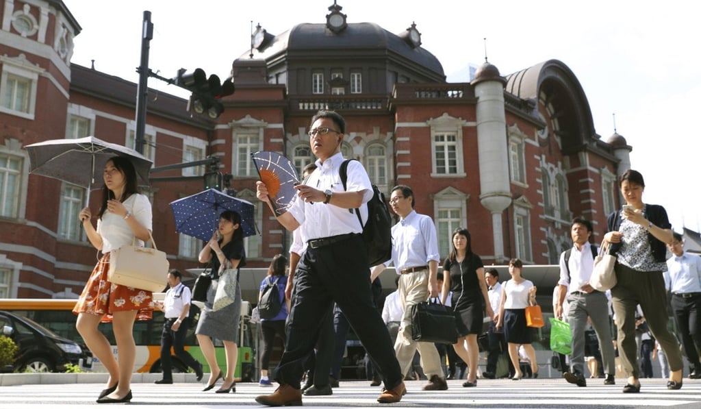 Pedestrians outside Tokyo Station, one of the buildings affected by the scandal surrounding KYB’s admission it falsified data about its seismic shock absorbers. Photo: AP