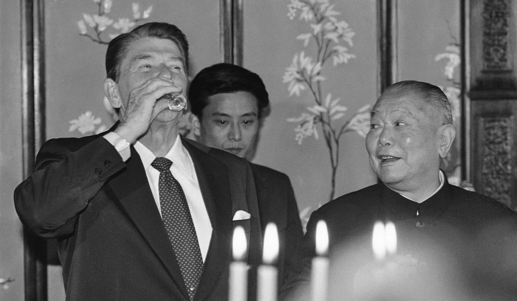 Chinese president Li Xiannian (right) smiles as US president Ronald Reagan samples baijiu in the Beijing in 1984. Picture: AP