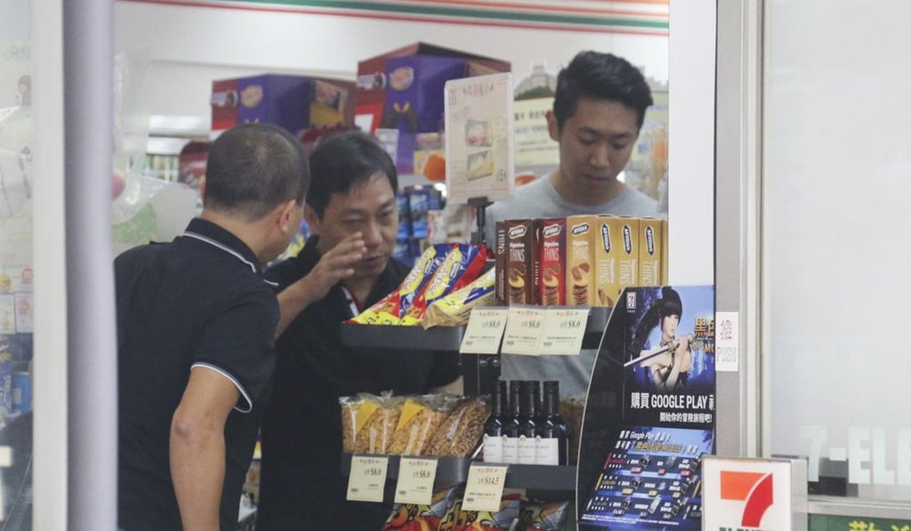 Police officers are investigating after an attempted robbery at the 7-Eleven store in Cheung Sha Wan. Photo: Handout