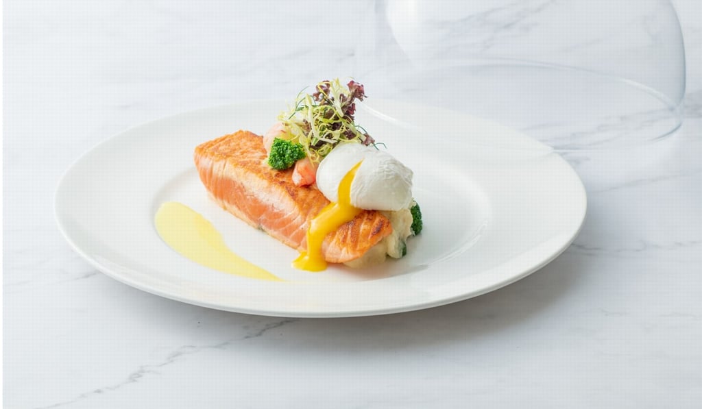 Pan-fried Atlantic salmon with onsen egg, potato and shrimp salad, served at Lumi. Picture: Lumi