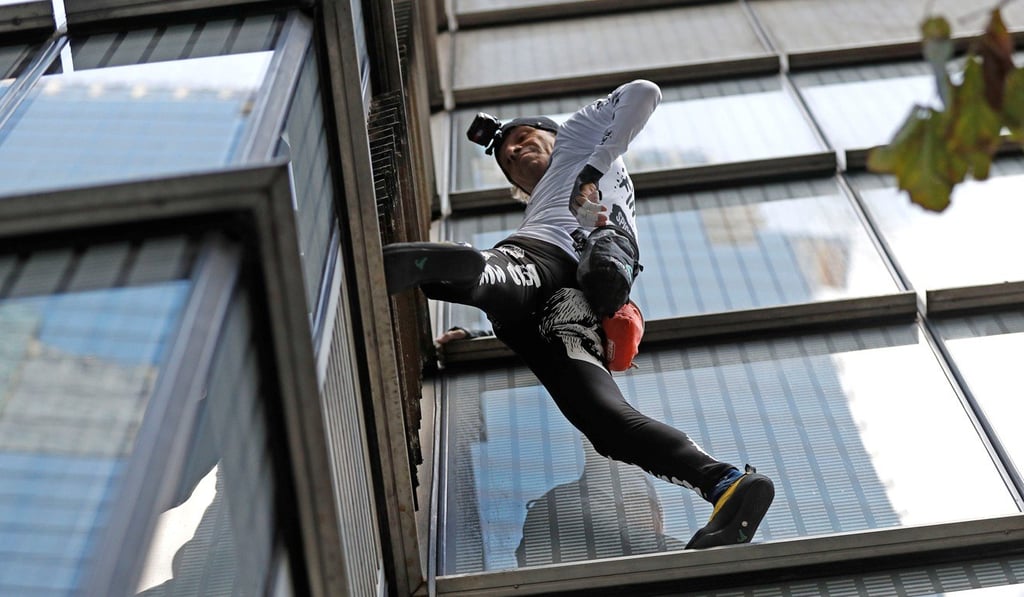 Alain Robert climbing Heron Tower in London. Photo: Reuters