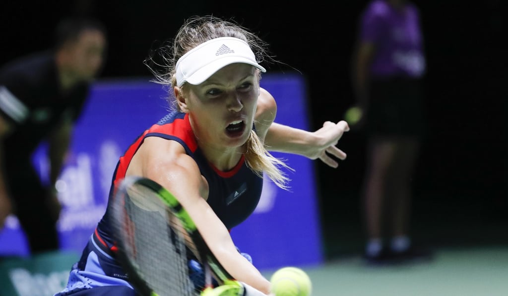 Caroline Wozniacki returns to Elina Svitolina. Photo: AP