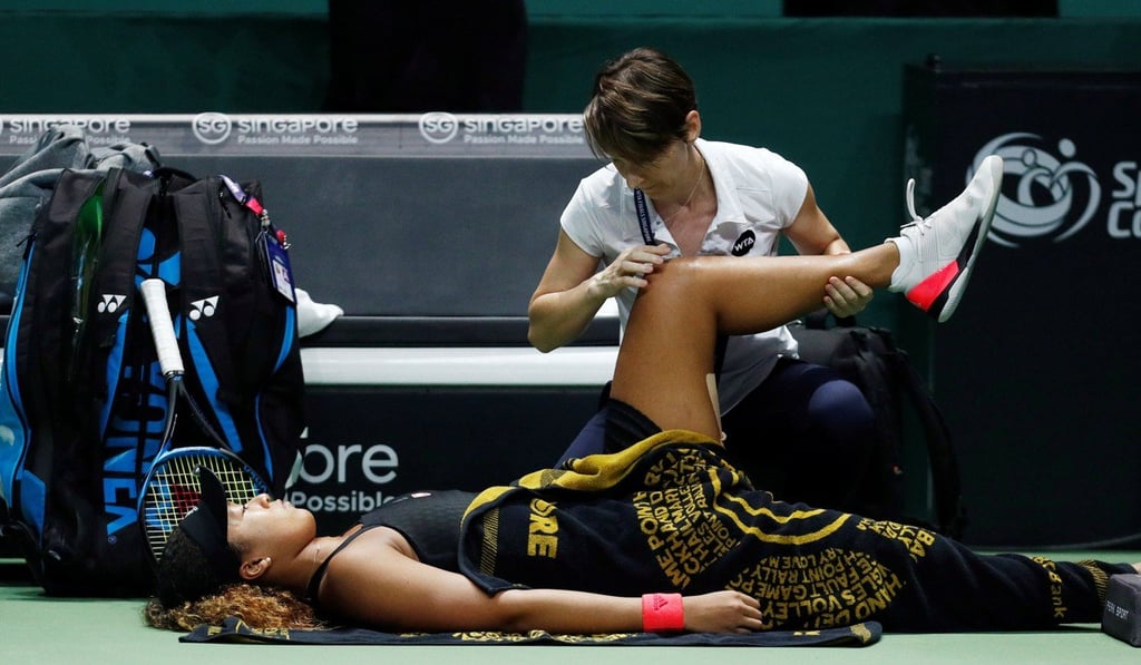 Naomi Osaka is treated by the doctor. Photo: Reuters