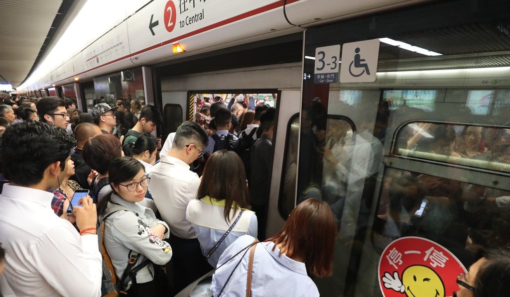 Passengers in Mong Kok feel the crunch as train service breaks down. Photo: Felix Wong