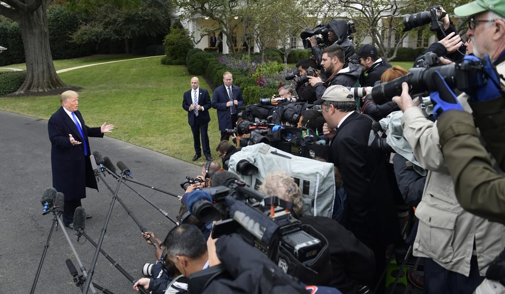 US President Donald Trump talks with reporters on the South Lawn of the White House in Washington on Friday. Photo: AP
