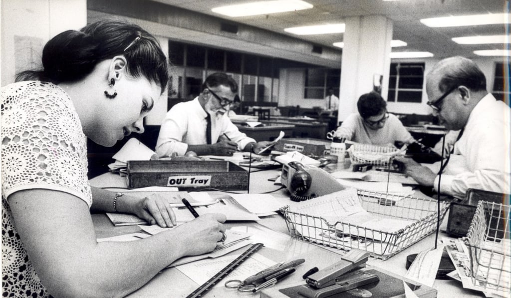 Subeditors use pens and paper to check stories at the Post office in Tong Chong Street, Quarry Bay, in April 1971. Photo: SCMP