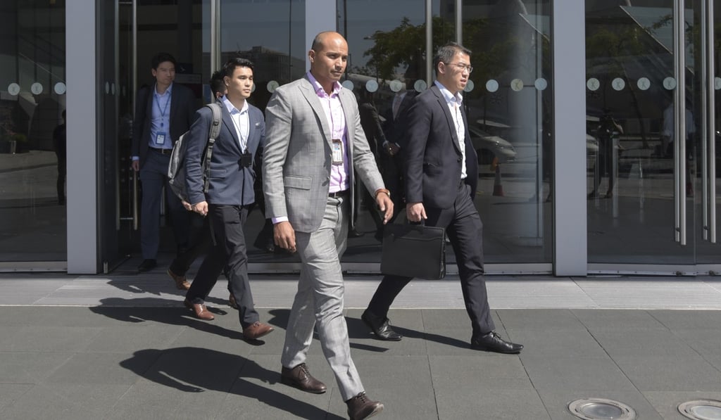 Officers from the Cyber Security and Technology Crime Bureau leave Cathay’s offices after collecting evidence linked to the data breach. Photo: Felix Wong