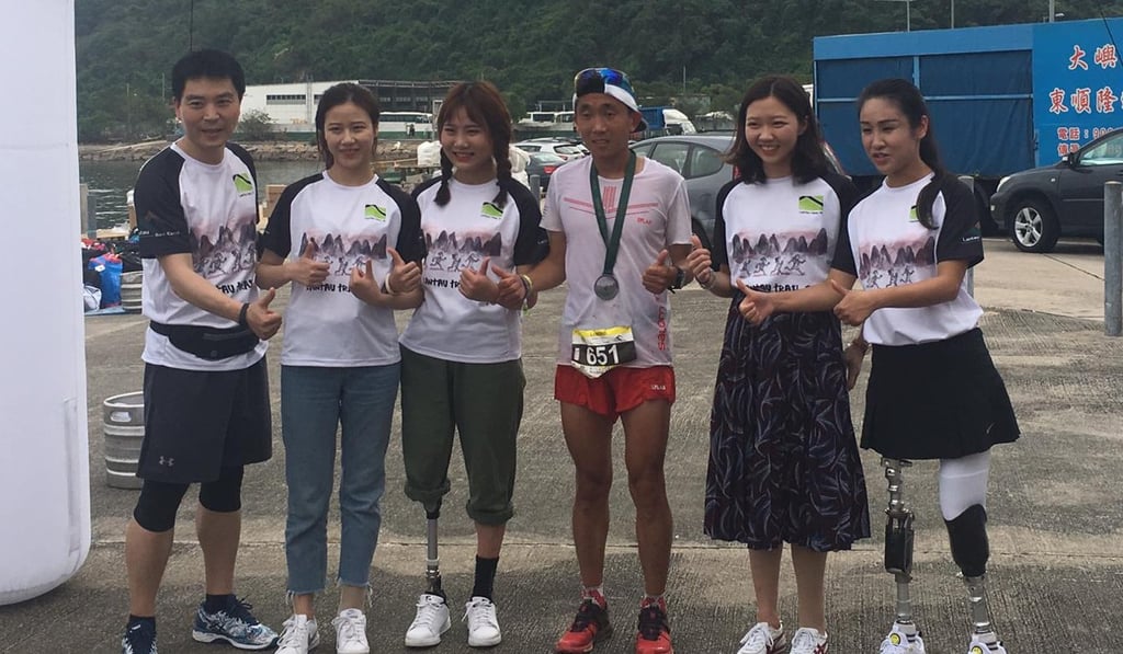 The Stand Tall runners with LT70 winner Yan Longfei. Photo: Ben Young The Stand Tall runners with LT70 winner Yan Longfei. Photo: Ben Young