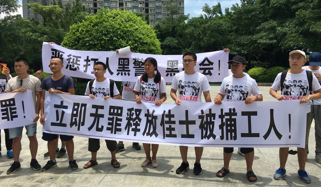 Student activists hold banners in support of Jasic Technology factory workers in Shenzhen in August. Photo: Reuters