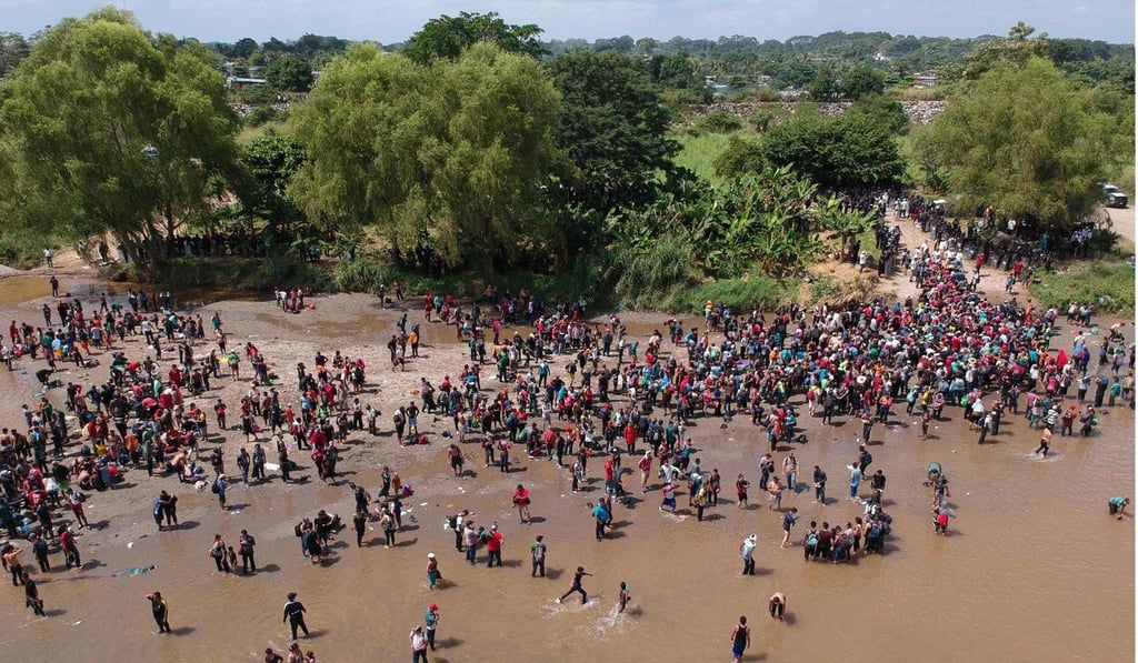 Migrants reaching Mexico after crossing the Suchiate River from Tecun Uman in Guatemala to Ciudad Hidalgo in Mexico on October 29, 2018. Photo: AFP Migrants reaching Mexico after crossing the Suchiate River from Tecun Uman in Guatemala to Ciudad Hidalgo in Mexico on October 29, 2018. Photo: AFP
