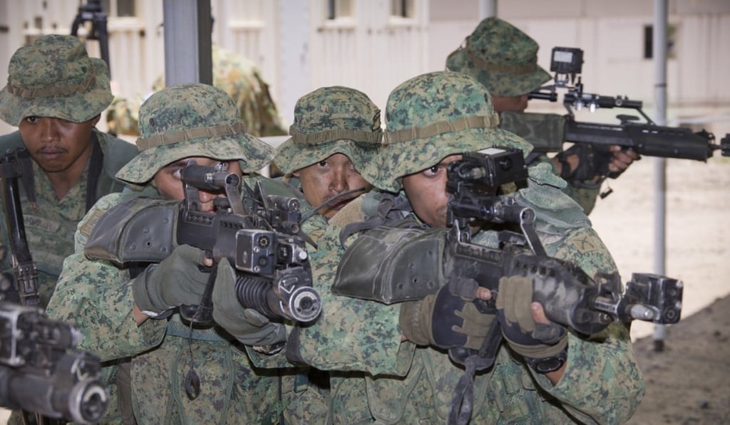 Singapore Army soldiers demonstrate urban assault techniques at the Shoalwater Bay training area in Queensland, Australia. Due to its perceived vulnerabilities as a small city state, Singapore has regularly spent a considerable amount of its annual budget on defence. Photo: Handout