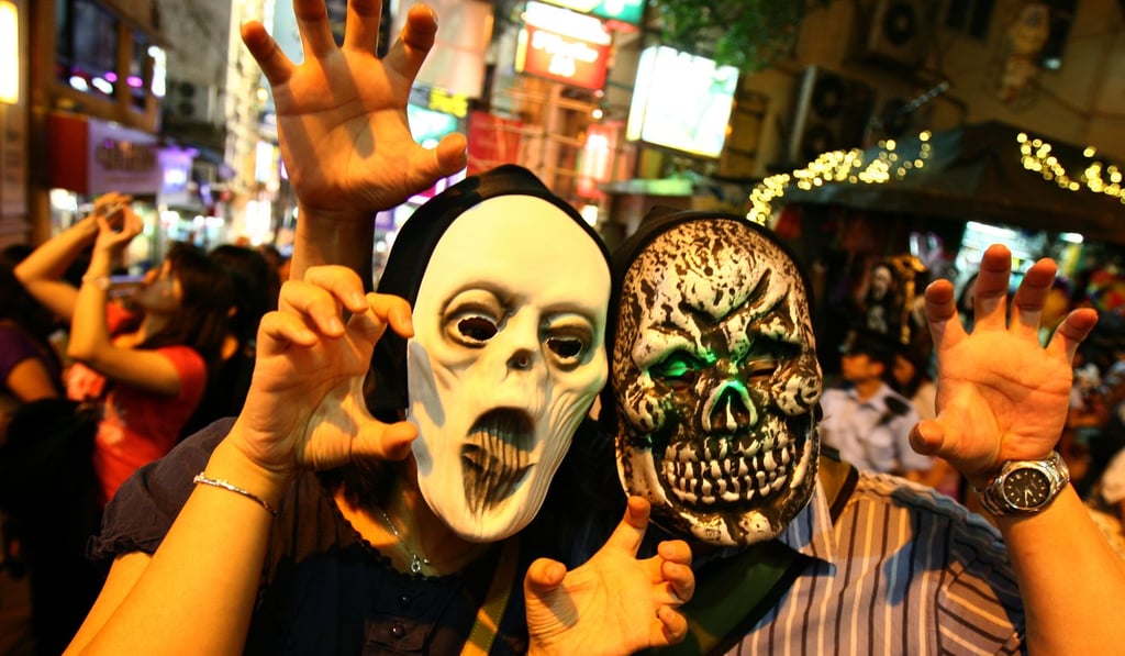 Revellers in scary costumes and masks celebrate Halloween in Lan Kwai Fong in Hong Kong. Photo: Oliver Tsang