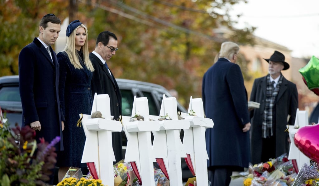 From left, White House senior adviser Jared Kushner, Ivanka Trump, Treasury Secretary Steven Mnuchin, US President Donald Trump, and Tree of Life Rabbi Jeffrey Myers visit a memorial for those killed at the Pittsburgh's Tree of Life Synagogue in Pittsburgh on Tuesday. Photo: AP From left, White House senior adviser Jared Kushner, Ivanka Trump, Treasury Secretary Steven Mnuchin, US President Donald Trump, and Tree of Life Rabbi Jeffrey Myers visit a memorial for those killed at the Pittsburgh's Tree of Life Synagogue in Pittsburgh on Tuesday. Photo: AP