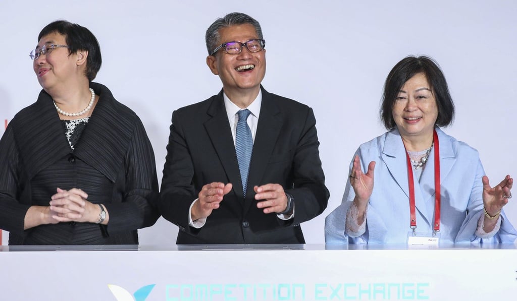 From left: Eliza Lee Man-ching, permanent secretary for commerce and economic development; guest of honour Financial Secretary Paul Chan Mo-po; and Anna Wu Hung-yuk, chairwoman of the Competition Commission. Photo: K.Y. Cheng
