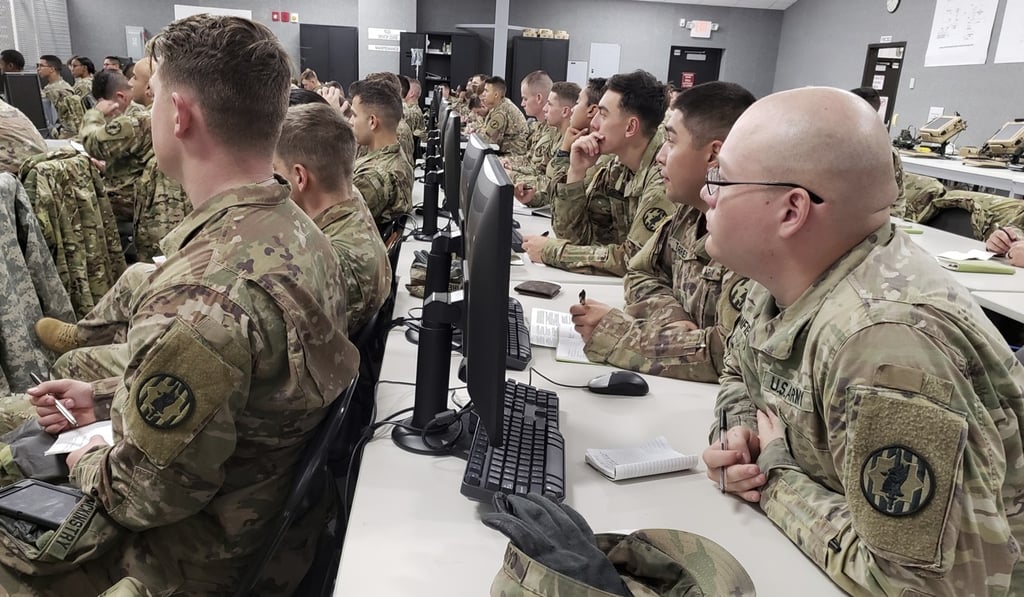 US soldiers receive a legal briefing as they prepare to be deployed to help secure the southwest border on Monday. Photo: AP