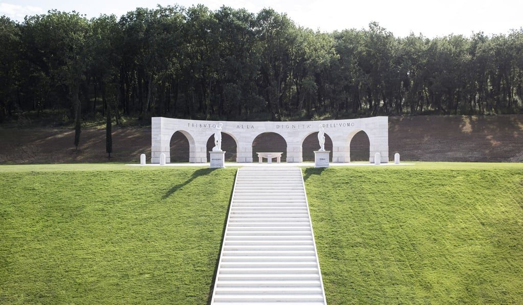 Travertine blocks form an arched structure in Solomeo, a monument to Bruno Cucinelli’s vision of upholding dignity.