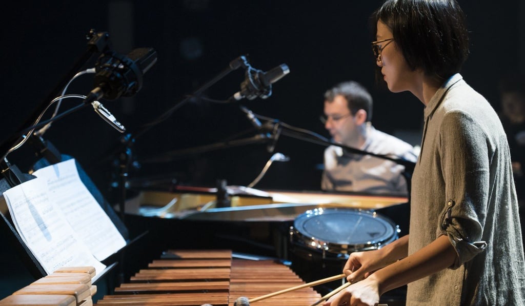 Heidi Law Hoi-yan, music designer of the Theatre de la Feuille’s production ‘Mad Man (Irregular Version)’, performs during an earlier stage production.