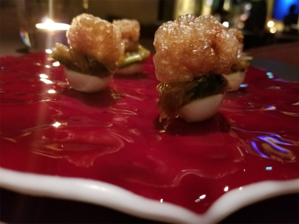 Quail’s egg with crunchy pork and chilli